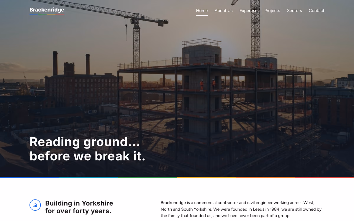 The Brackenridge Build home page: “Reading ground… before we break it.” over a photograph of a steel frame under construction at dusk