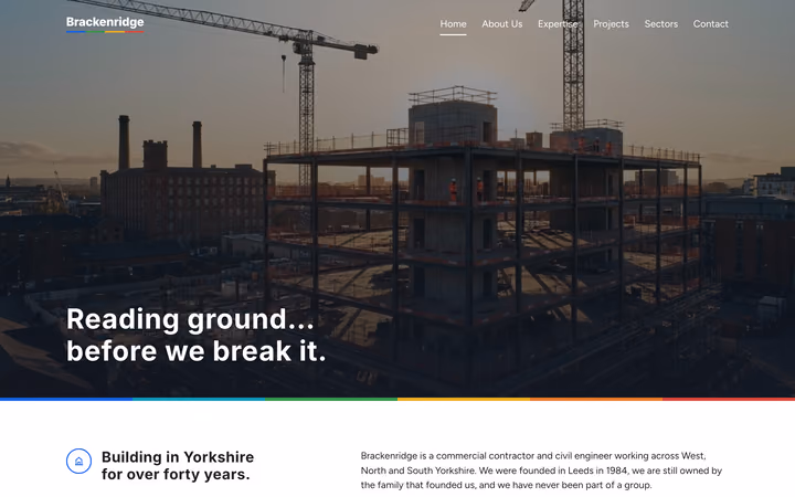 The Brackenridge Build home page: “Reading ground… before we break it.” over a photograph of a steel frame under construction at dusk