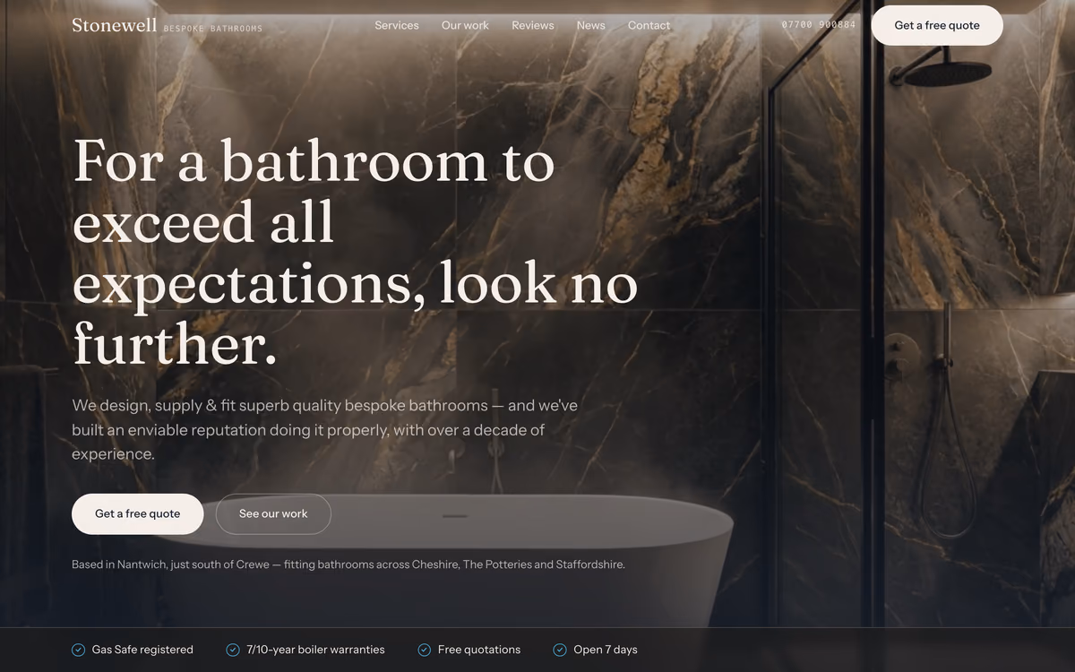 The Stonewell Bathrooms home page: “For a bathroom to exceed all expectations, look no further.” in a serif over a photograph of a dark marble walk-in shower